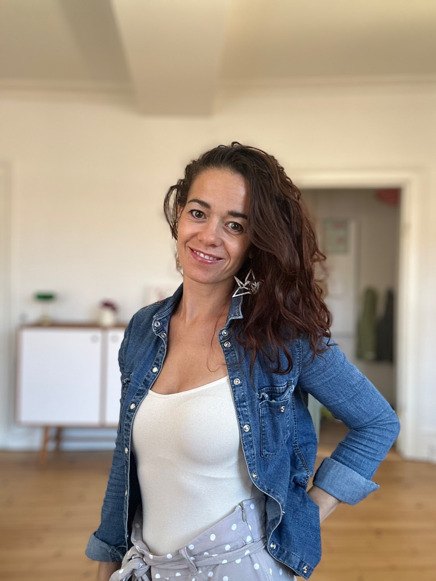 Audrey looking at the camera and smiling before a connection call