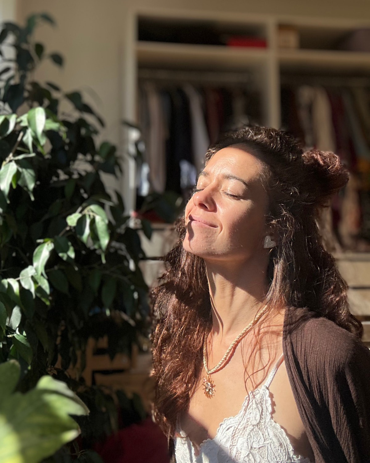 Audrey with her eyes closed, enjoying a quiet moment in the sunlight